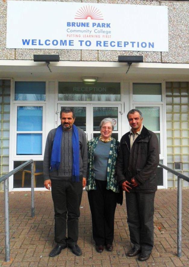 Two olive farmers with GFA Coordinator outside Brune Park School in Fairtrade Fortnight in 2012